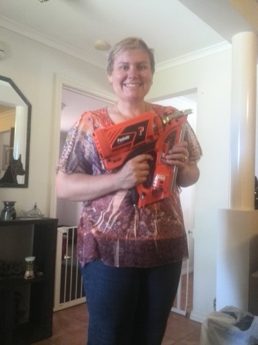 Smiles!!!! Stacey with her nail gun Christmas day.